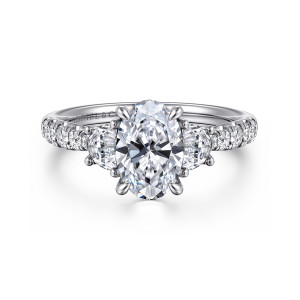 Gabriel & Co. ER16507O6W44JJ 14 karat white gold Lotus engagement ring, front view of an oval center between two half moon stones with diamonds running down the shoulders