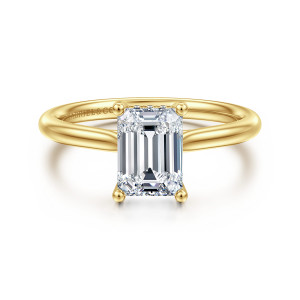 Gabriel & Co. ER16512E6Y44JJ 14 karat yellow gold Classic engagement ring, front view of an emerald cut center with ball tipped corner prongs and a plain tapering band