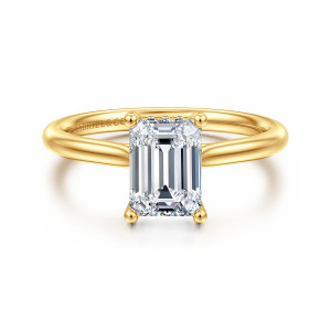 Gabriel & Co. ER16512E6Y84JJ 18 karat yellow gold Classic engagement ring, front view of an emerald cut center with ball tipped corner prongs on a smooth band