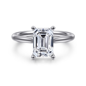 Gabriel & Co. ER16512E8PT4JJ platinum Classic engagement ring, front view of an emerald cut center held at its corners by ball tipped prongs