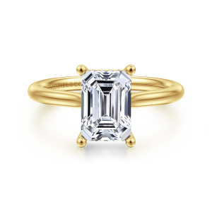 Gabriel & Co. ER16512E8Y44JJ 14 karat yellow gold Classic engagement ring, front view of an emerald cut center held by ball tipped prongs on a plain rounded band