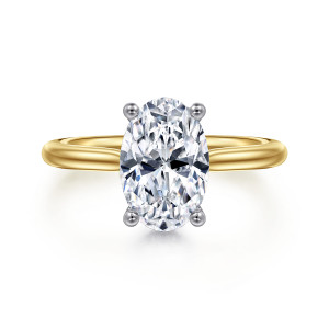 Gabriel & Co. ER16512O8M44JJ 14 karat white and yellow gold Classic engagement ring, front view of an oval center held by rounded prongs with the cooler tone at the head