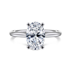 Gabriel & Co. ER16512O8W44JJ 14 karat white gold Classic engagement ring, front view of a tall oval center framed by ball tipped prongs on a slim band