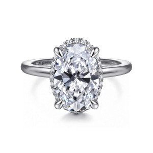 Gabriel & Co. ER16516O12W44JJ 14 karat white gold Classic engagement ring, front view of an oval center in four claw prongs with a fine halo edge around it