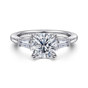 Gabriel & Co. ER16517R6W43JJ 14 karat white gold Classic engagement ring, front view of a round center between two bar set tapered baguettes on the shoulders