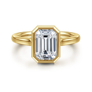 Gabriel & Co. ER16527E8Y4JJJ 14 karat yellow gold Contemporary engagement ring, front view of an emerald cut center wrapped in a bezel with clipped corners