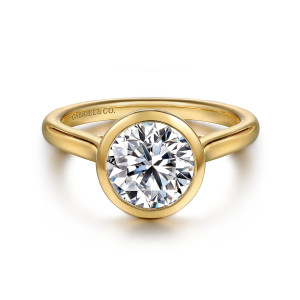 Gabriel & Co. ER16527R8Y4JJJ 14 karat yellow gold Contemporary engagement ring, front view of a round center in a smooth full bezel with a maker's mark inside the band