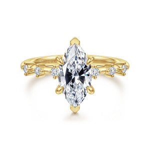 Gabriel & Co. ER16530M6Y44JJ 14 karat yellow gold Starlight engagement ring, front view of a marquise center between spaced round diamonds, with claws at both pointed ends