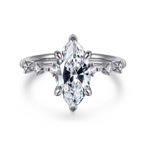 Gabriel & Co. ER16530M8W44JJ 14 karat white gold Starlight engagement ring, front view of a pointed marquise center in claws, with small round diamonds spaced along both shoulders