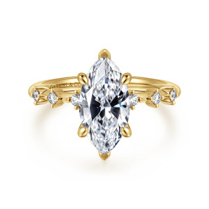 Gabriel & Co. ER16530M8Y44JJ 14 karat yellow gold Starlight engagement ring, front view of a marquise center with pointed tips and small round diamonds spaced along the shoulders