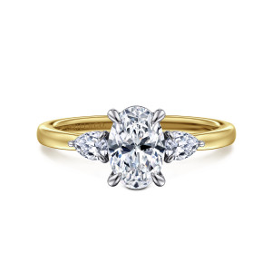 Gabriel & Co. ER16551O4M44JJ 14 karat white and yellow gold Contemporary engagement ring, front view of an oval center between two pear shaped side stones on a smooth band