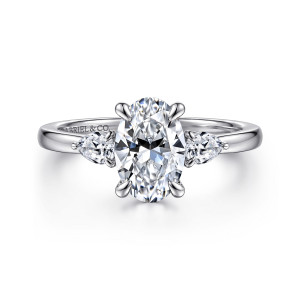 Gabriel & Co. ER16551O6W44JJ 14 karat white gold Contemporary engagement ring, front view of an oval center flanked by pear stones with points outward on a plain band