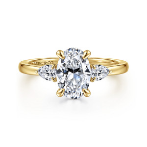 Gabriel & Co. ER16551O6Y44JJ 14 karat yellow gold Contemporary engagement ring, front view of an oval center held by four prongs with a pear shaped stone at each side