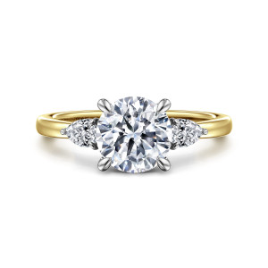 Gabriel & Co. ER16551R6M44JJ 14 karat white and yellow gold Contemporary engagement ring, front view of a round center with four prongs between pear shaped diamonds pointing outward