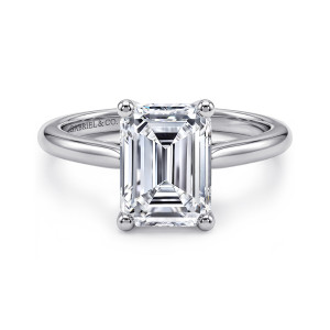 Gabriel & Co. ER16561E12W4JJJ 14 karat white gold Contemporary engagement ring, front view of an emerald cut center held by four ball tipped prongs on a smooth band