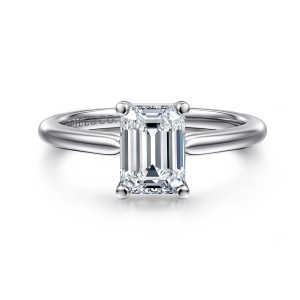 Gabriel & Co. ER16561E6W4JJJ 14 karat white gold Contemporary engagement ring, front view of an emerald cut center in four rounded tip prongs on a smooth band
