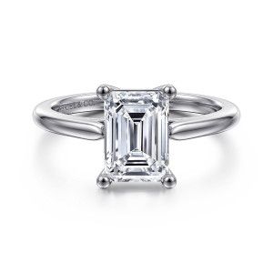 Gabriel & Co. ER16561E8W4JJJ 14 karat white gold Contemporary engagement ring, front view of an emerald cut center held at its corners by ball tipped prongs