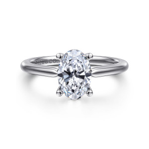 Gabriel & Co. ER16561O6W4JJJ 14 karat white gold Contemporary engagement ring, front view of the oval center between four ball tipped prongs on a smooth unset band