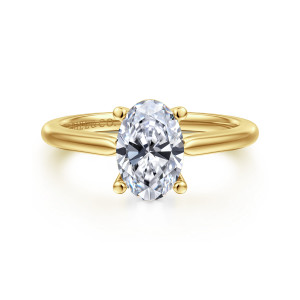 Gabriel & Co. ER16561O6Y4JJJ 14 karat yellow gold Contemporary engagement ring, front view of an oval center gripped by four ball tipped prongs on a plain tapering band
