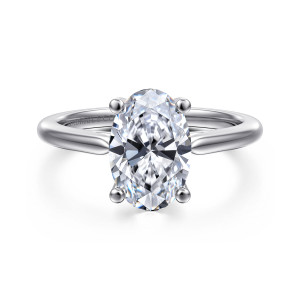 Gabriel & Co. ER16561O8W4JJJ 14 karat white gold Contemporary engagement ring, front view of an oval center on four ball tipped prongs above a smooth plain band