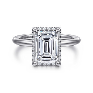 Gabriel & Co. ER16565E10W44JJ 14 karat white gold Contemporary engagement ring, front view of an emerald cut center with small diamonds peeking out around its edge