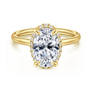 Gabriel & Co. ER16565O10Y44JJ 14 karat yellow gold Contemporary engagement ring, front view of an oval center with four prongs and a fine edge of diamonds below it