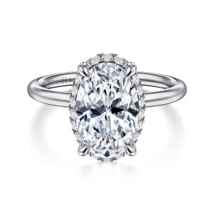 Gabriel & Co. ER16565O12W44JJ 14 karat white gold Contemporary engagement ring, front view of an oval center with a fine ring of small diamonds showing around its edge