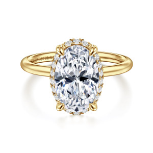 Gabriel & Co. ER16565O12Y44JJ 14 karat yellow gold Contemporary engagement ring, front view of an oval center with small diamonds showing around its edge and a plain smooth band