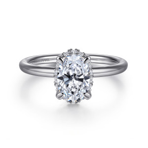 Gabriel & Co. ER16565O4W44JJ 14 karat white gold Contemporary engagement ring, front view of an oval center with four corner prongs and a fine edge of diamonds behind it