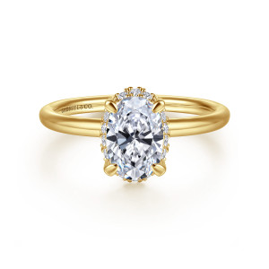 Gabriel & Co. ER16565O4Y44JJ 14 karat yellow gold Contemporary engagement ring, front view of an oval center with halo stones peeking out along its sides