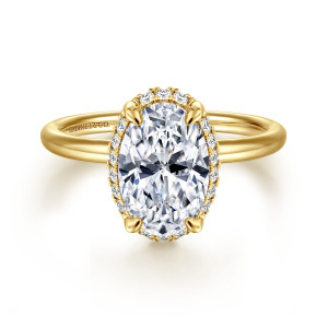 Gabriel & Co. ER16565O8Y44JJ 14 karat yellow gold Contemporary engagement ring, front view of an oval center with teardrop claws and small diamonds ringing its edge
