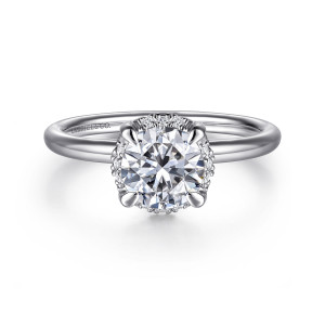 Gabriel & Co. ER16565R4W44JJ 14 karat white gold Contemporary engagement ring, front view of a round center with small diamonds showing between four rounded prongs