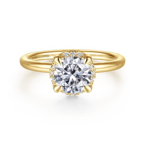 Gabriel & Co. ER16565R4Y44JJ 14 karat yellow gold Contemporary engagement ring, front view of the round center with bulb tipped prongs and small diamonds glinting at the head's edge