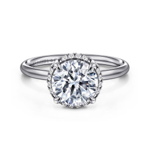 Gabriel & Co. ER16565R8W44JJ 14 karat white gold Contemporary engagement ring, front view of a round center with small diamonds showing at its edge above a plain rounded band