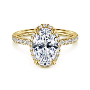 Gabriel & Co. ER16566O10Y44JJ 14 karat yellow gold Contemporary engagement ring, front view of an oval center with a thin ring of small diamonds peeking out around its edge
