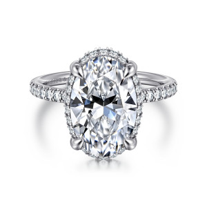 Gabriel & Co. ER16566O16W44JJ 14 karat white gold Contemporary engagement ring, front view of a long oval center in four claws above small diamonds along the band