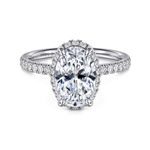 Gabriel & Co. ER16566O8W44JJ 14 karat white gold Contemporary engagement ring, front view of an oval center ringed by small round diamonds with a claw at each corner