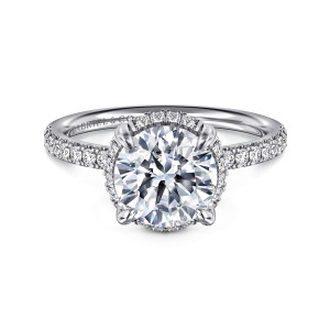 Gabriel & Co. ER16566R8W44JJ 14 karat white gold Contemporary engagement ring, front view of a round center with small diamonds glinting beneath it and along the band