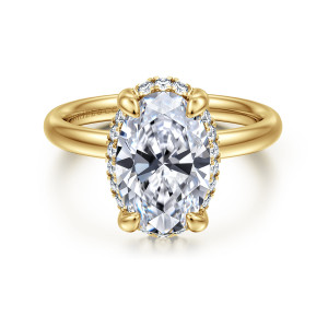 Gabriel & Co. ER16567O12Y44JJ 14 karat yellow gold Contemporary engagement ring, front view of an oval center with small diamonds glinting around its edge on a smooth band