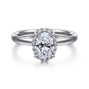 Gabriel & Co. ER16567O4W44JJ 14 karat white gold Contemporary engagement ring, front view of an oval center on four claw prongs with a thin diamond edge around it