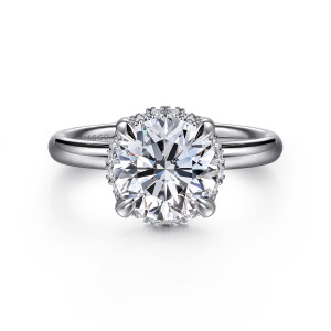 Gabriel & Co. ER16567R8W44JJ 14 karat white gold Contemporary engagement ring, front view of a round center with tiny halo diamonds peeking out between the claws