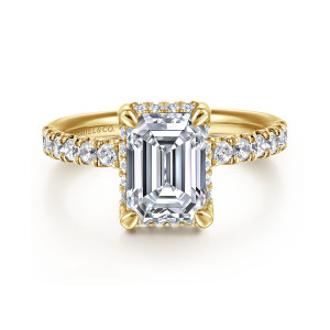 Gabriel & Co. ER16568E8Y44JJ 14 karat yellow gold Contemporary engagement ring, front view of an emerald cut center in corner claws with round diamonds on both shoulders