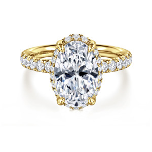 Gabriel & Co. ER16568O12Y44JJ 14 karat yellow gold Contemporary engagement ring, front view of an oval center with a diamond frame and round stones on the shoulders