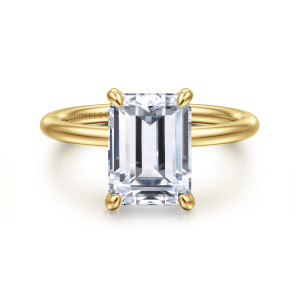 Gabriel & Co. ER16569E12Y4JJJ 14 karat yellow gold Contemporary engagement ring, front view of an emerald cut center at four corner prongs on a smooth round wire band