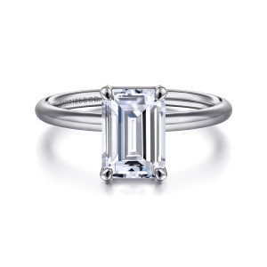Gabriel & Co. ER16569E8W4JJJ 14 karat white gold Contemporary engagement ring, front view of an emerald cut center in claw prongs on a slim rounded band with no stones