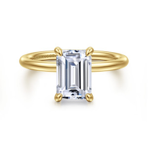 Gabriel & Co. ER16569E8Y4JJJ 14 karat yellow gold Contemporary engagement ring, front view of the emerald cut center with a claw at each corner and a smooth rounded band