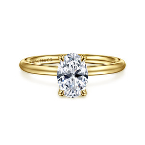 Gabriel & Co. ER16569O4Y4JJJ 14 karat yellow gold Contemporary engagement ring, front view of an oval center in four claw prongs on a slim polished band