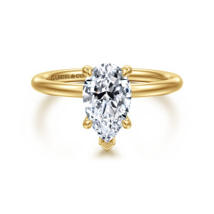 Gabriel & Co. ER16569P6Y4JJJ 14 karat yellow gold Contemporary engagement ring, front view of a pear shaped center with a V shaped prong at its narrow tip