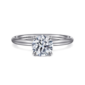 Gabriel & Co. ER16569R4W4JJJ 14 karat white gold Contemporary engagement ring, front view of a round center held by slim prongs on a thin, stoneless band