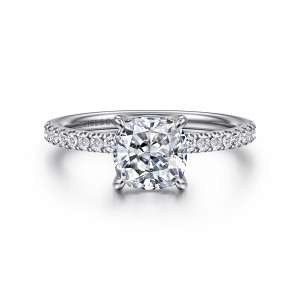 Gabriel & Co. ER16570C6PT4JJ platinum Contemporary engagement ring, front view of a cushion shaped center in claw prongs with small diamonds along the band